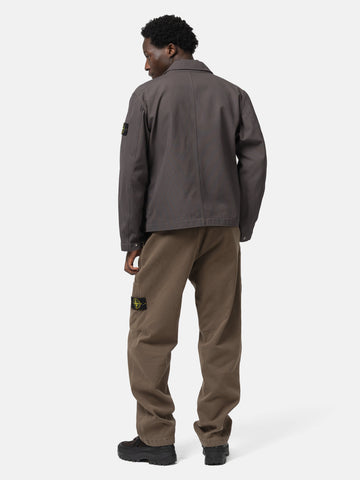 Back shot of the model wearing the Stone island Cotton Canvas Coach Jacket Charcoal