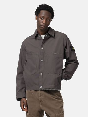 Half body shot of the model wearing the Stone island Cotton Canvas Coach Jacket Charcoal