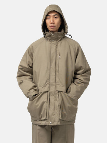 Half body shot of the Model wearing the organic cotton chino half coat from URU.