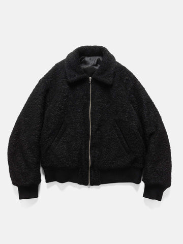 Flat shot in studio of the Wool Boa Zip-up blouson from URU.