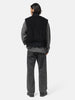 rear view of the Model in studio wearing Wool Boa Zip Up Vest Black fro URU