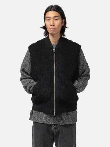 Hlaf body shot of the Model wearing Wool Boa Zip Up Vest Black fro URU