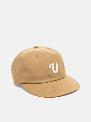 Shot in studio of the UNLIKELY Team Cap in Beige