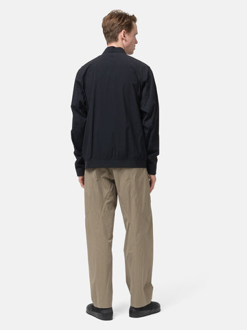 Back shot of the model wearing the Veilance Spere Cargo Pant Lt Gnosis