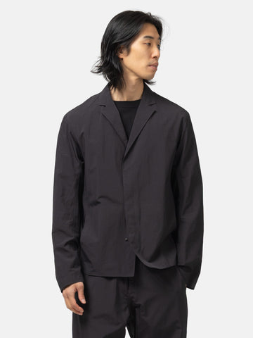 Half body shot of the model wearing the Veilance Spere SL Blazer M Black