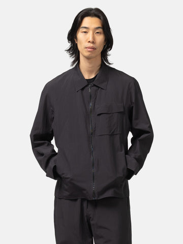 Half-body shot of the model wearing the Veilance Spere SL Jacket M Black