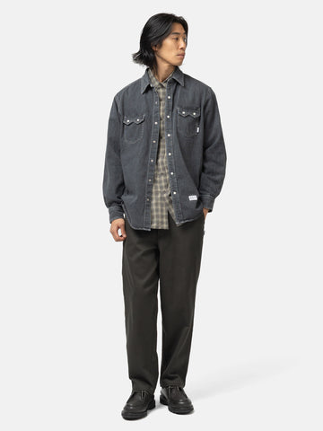 Full body shot of the model wearing he WTAPS Allman / LS / Cotton. Denim Black