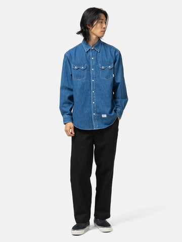Full body shot of the model wearing the WTAPS Allman / LS / Cotton. Denim Indigo