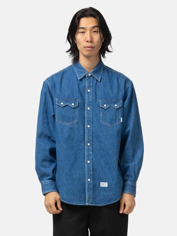 half body shot of the model wearing the WTAPS Allman / LS / Cotton. Denim Indigo