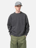Half body shot of the Model standing in studio wearing the WTAPS Crewneck Sweater in NYCO Black