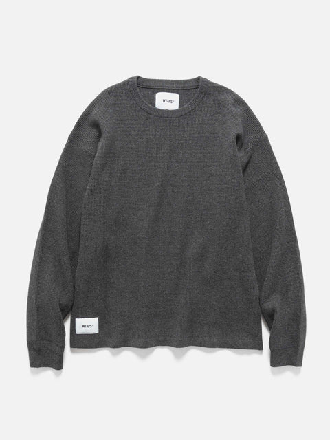 Flat shot of WTAPS KRS UPR Sweater in NYCO Black