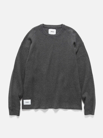 Flat shot of WTAPS KRS UPR Sweater in NYCO Black