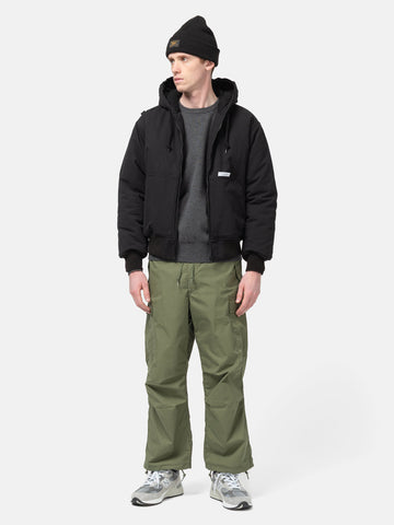 full-body view of model wearing WTAPS puff doom jacket in cotton weather black