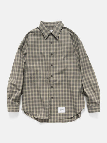 Flat shot of the WTAPS Txt 01 / LS / Poly. Broadcloth. Textile. Of Olive Drab