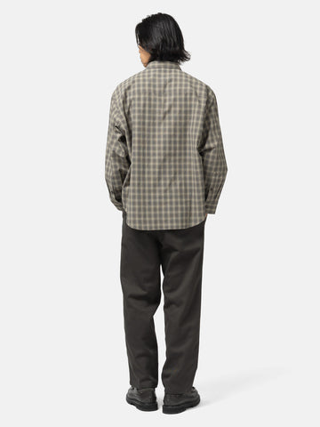 back shot of the model wearing the WTAPS Txt 01 / LS / Poly. Broadcloth. Textile. Of Olive Drab
