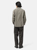 back shot of the model wearing the WTAPS Txt 01 / LS / Poly. Broadcloth. Textile. Of Olive Drab