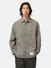 half body shot of the model wearing the WTAPS Txt 01 / LS / Poly. Broadcloth. Textile. Of Olive Drab