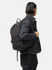 Model is wearing the HOBO Backpack 22L Nylon Oxford Onibegie Dyed Charcoal