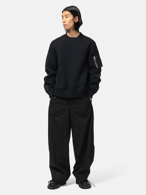 full-body view of the model wearing the sacai Cotton Typewriter Pants Black