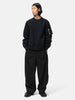 full-body view of the model wearing the sacai Cotton Typewriter Pants Black