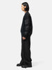 side-body view of the model wearing the sacai Cotton Typewriter Pants Black