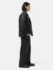 side-body view of the sacai Denim Pants Black