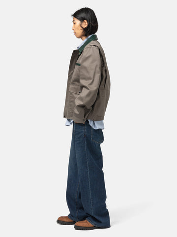 side-body view of the model wearing the sacai Denim Pants Blue