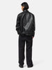 rear view of the model wearing the sacai Leather Blouson Black