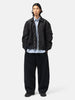 full-body view of the model the sacai Sponge Sweat Pants Black