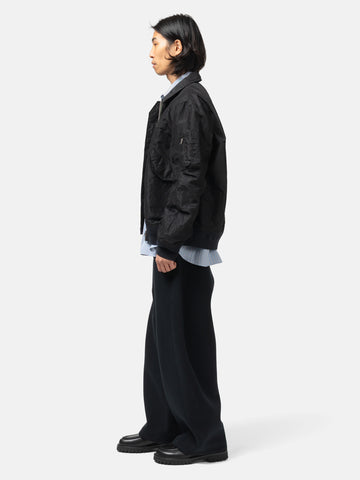 side-body view of the model the sacai Sponge Sweat Pants Black