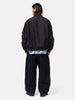 rear view of the model the sacai Sponge Sweat Pants Black