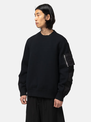 half-body of the model wearing the sacai Sponge Sweat Pullover Black