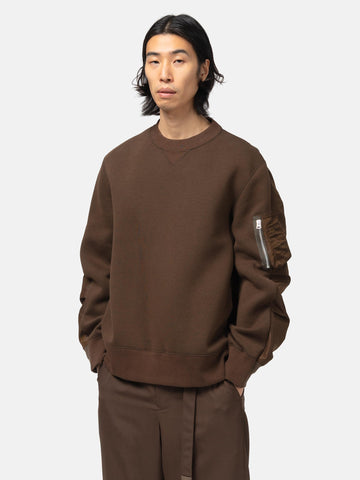 half-body view of the model wearing the sacai Sponge Sweat Pullover Brown