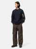 Full-body view of the model wearing the sacai Sponge Sweat Pullover Navy x Khaki