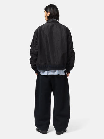 rear view of the model wearing the sacai Treated Nylon Twill Blouson Black