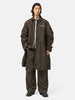 Full-body view of the model wearing the sacai Treated Nylon Twill Coat Khaki