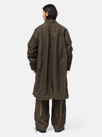 rear view of the model wearing the sacai Treated Nylon Twill Coat Khaki