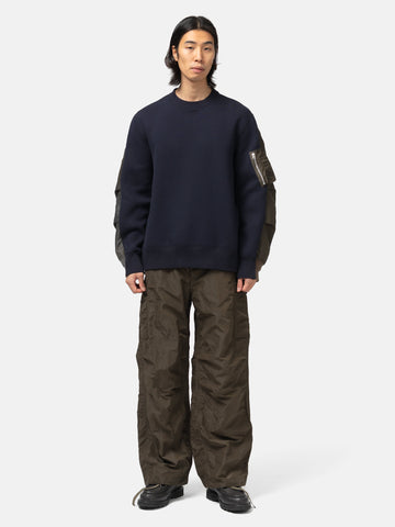 full-body view of the model wearing the sacai Treated Nylon Twill Pants Khaki