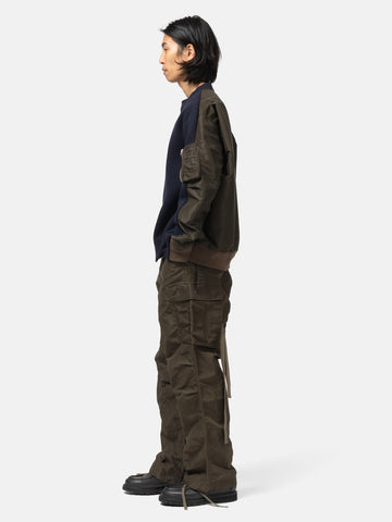 side-body view of the model wearing the sacai Treated Nylon Twill Pants Khaki
