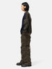 side-body view of the model wearing the sacai Treated Nylon Twill Pants Khaki