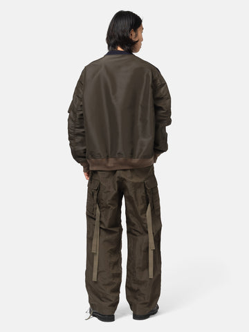 rear view of the model wearing the sacai Treated Nylon Twill Pants Khaki